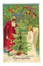 Early 1900's Christmas Postcard Old World Santa Chopping Tree With Angel picture