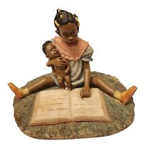 Figurine Of Woman and Baby Reading picture