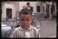 sl81 Original slide 1970’s  China  city street boy “ angry face “ 629a picture