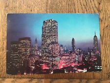 Night Falls on Midtown Manhattan New York City NY Postcard picture