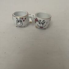 Collecting - Pair of Mini-Cups of coffee representing a couple arm in arm picture