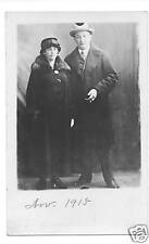 Original 1915 RPPC-Couple Standing-Both W/ Long Coats & Hats-Real Photo Postcard picture