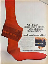 Vintage 1968 Kodak Instamatic Movie Camera Stuffed In Red Stocking Advertisement picture