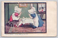 Two Young Girls Saying Grace Before Tea With Cat ANTIQUE POSTCARD 996 picture