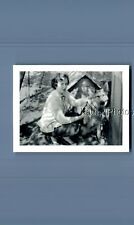 FOUND B&W PHOTO N_3601 PRETTY WOMAN POSED CROUCHING BY DOG picture