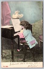 LITTLE GIRL PLAYING PIANO HUNGARIAN ANTIQUE WIDE LINEN VINTAGE POSTCARD 1905 picture