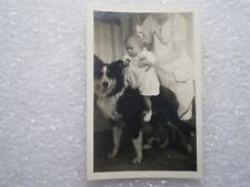 A CHILD RIDES A DOG~SMALL VINTAGE PHOTO SNAPSHOT  2.5'' X 1.5'' picture