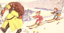 c1920s Christmas Postcard Yellow Robed Sant Brown Sack Pulls Children on Skis picture