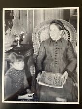 Elderly Woman And Child In Parlor With A Copy Of Scribner’s Magazine Photo picture
