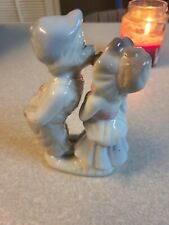 Vintage Porcelain Girl and Boy Kissing on the Cheek Holding Presents  picture