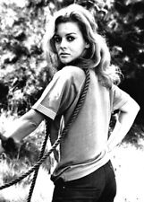 Ann-Margret R.P.M.1970 in t-shirt & jeans looks over shoulder 11x17 inch poster picture