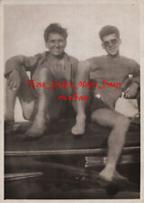 1950s Affectionate Men sitting on Hot Rod Car in tight shorts - Gay Int Photo picture