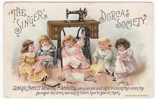 c1895 Singer Sewing Mfg Co.~Dorcas Society~Girls Sewing Doll Clothes~Trade Card picture