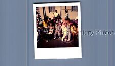 FOUND COLOR POLAROID K+1955 KIDS IN HALLOWEEN COSTUMES SITTING TOGETHER picture