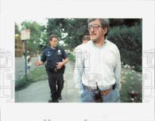 1993 Press Photo Jorge Merida walks though Capitol Hill with police officer picture