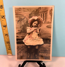 Antique Sweet girl sitting for a photo French cancelled postcard & Stamp. picture