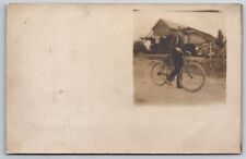 Norton Ohio to Newark~Young Man Shows Off Early Bicycle~Store~Signs~1906 RPPC picture