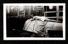 CABIN WOMAN SLEEPING/REASTING ON OVERTURNED BOAT OLD/VINTAGE PHOTO SNAPSHOT-K196 picture
