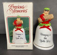 Precious Memories Handcrafted Porcelain Holiday Bell Bringing in the Yule Log picture