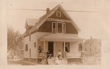 VINTAGE POSTCARD FAMILY SITTING ON THE OUTSIDE PORCH KRUXO REAL PHOTO (1907-20) picture