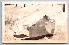 RPPC Smiling Baby Deloris in Homemade Sled Winter Snow c1915 Real Photo Postcard picture