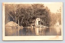 RPPC Unknown Camp Lake-Side Boat Garage American Flag Real Photo Postcard picture
