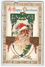 1912 Christmas Santa Claus Holly Berries Mistletoe Embossed Antique Postcard picture