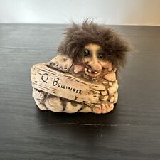 vintage norwegian nyform troll behind Rock Wall With Sign  picture