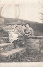 Little Boy in Knickers & Girl in Pigtails Sit on Steps Photo Postcard 1910s-20s picture