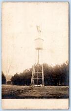 1920's ERA RPPC MAN STANDING ON TOP OF A WATER TOWER LOCATION UNKNOWN POSTCARD picture