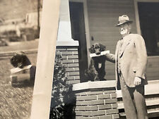 x2 Vintage Found Snapshot Photo Man Posing w/ Dog Holding Newspaper in Mouth picture