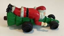 VINTAGE SANTA RIDING ON A TREE SLED  - PLASTIC approximately 7” long, 3” wide picture