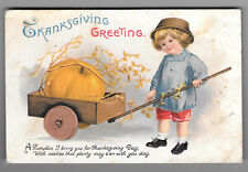 1916 International Art Co Thanksgiving Greetings Child Pumpkin Embossed Postcard picture