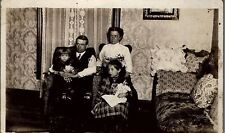 c1910 FAMILY WITH BOY AND GIRL AND BABY DOLL REAL PHOTO RPPC POSTCARD 38-21 picture