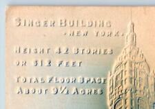 1907 SINGER BUILDING NYC EMBOSSED AIRBRUSHED ANTIQUE POSTCARD BLUE & WHITE picture