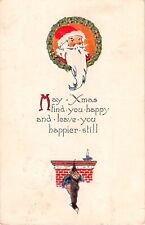 1923 Art Deco Christmas Motto PC-Santa & Holly Wreath by Stocking on Fireplace picture