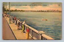 Fishing From County Causeway Miami Skyline in Distance Florida Postcard picture