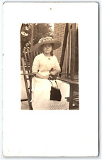 RPPC EARLY 1900s WOMAN POSING WITH HAT AND PURSE POSTCARD picture