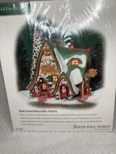 NEW DEPT 56 HAND CARVED NUTCRACKER FACTORY  NORTH POLE SNOW VILLAGE CHRISTMAS picture