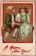 1908 Tuck's HAPPY NEW YEAR Postcard Boy & Girl with Chestnuts *Writing on Front picture