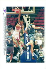 New Jersey Nets guard Kerry Kittles (L) stuffs... - Vintage Photograph 2493799 picture