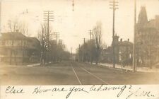 Postcard RPPC Michigan Menominee Street View Trolley Train Tracks 23-10048 picture