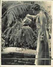 1932 Press Photo Miss P.C. Mayer Watering Her House Fern - nei42583 picture