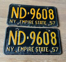 TWO VINTAGE 1957 NEW YORK STATE LICENSE PLATES BOTH WITH THE SAME NUMBER ND-9608 picture
