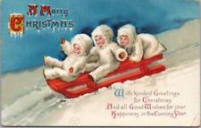 Vintage Artist-Signed CLAPSADDLE Christmas Postcard Kids in White on Snow Sled picture