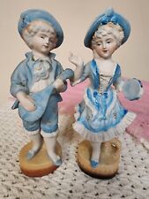 Vintage L & M INC. 8 1/2 '' TALL SET OF TWO BISQUE FIGURINES BOY & GIRL IN BLUE picture
