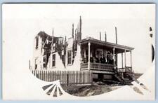 1910 RPPC BURNED OUT HOUSE PEOPLE ON FRONT PORCH IMAGE IN ARTIST PALETTE SHAPE picture
