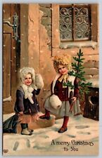 Postcard EAS A Merry Christmas to You Girl with Tree Embossed Greeting J30 picture