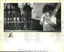 1990 Press Photo Tiffany Reites, 5, Shrinks Back From Splash at Boat Show picture