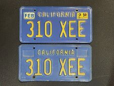CALIFORNIA LICENSE PLATE PAIR BLUE 310 XEE FEBRUARY 1994 LICENSE PLATE CAR TAG picture